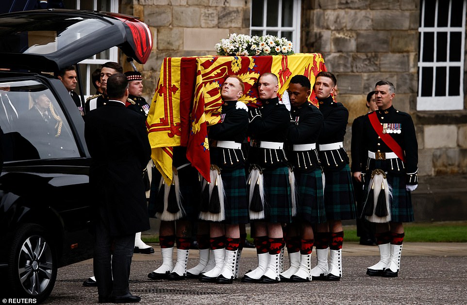 The hearse carrying the coffin of Queen Elizabeth II arrives at the Palace of Holyroodhouse in Edinburgh